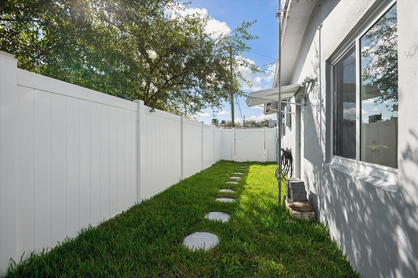 All remodeled with a new open kitchen and large impact sliders - photo 18