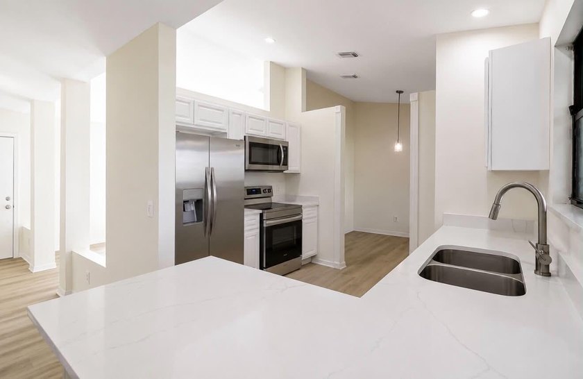 A 2026 roof, gorgeous quartz countertops in the kitchen, and - photo 4