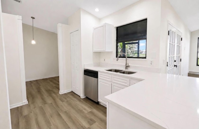 A 2026 roof, gorgeous quartz countertops in the kitchen, and - photo 5