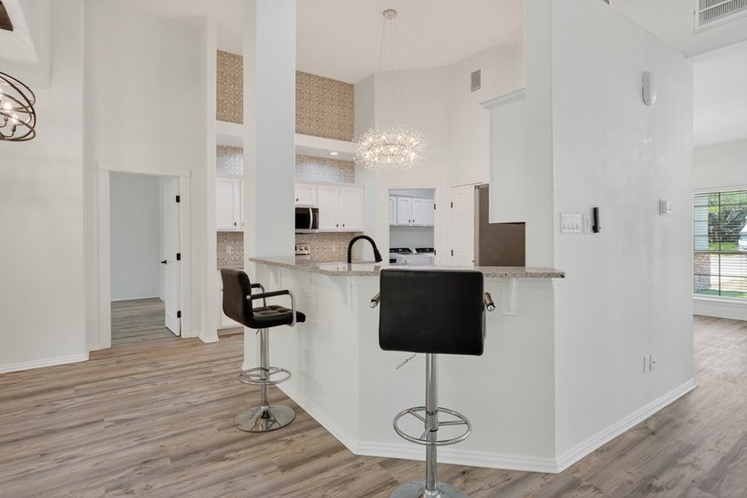 This lovely 2051 sq. ft. stucco home sits on a large lot in the - photo 12