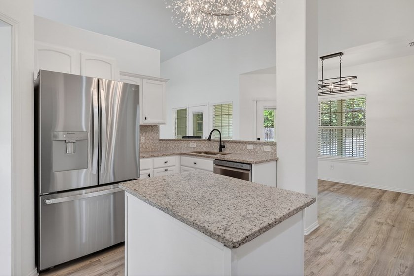 This lovely 2051 sq. ft. stucco home sits on a large lot in the - photo 15