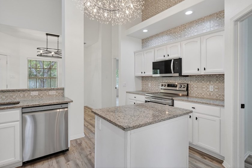 This lovely 2051 sq. ft. stucco home sits on a large lot in the - photo 16