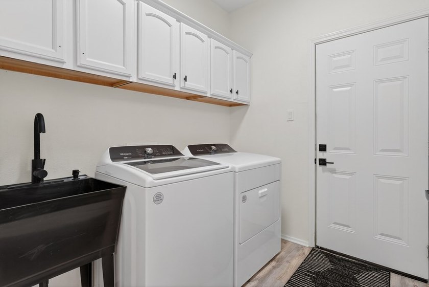 This lovely 2051 sq. ft. stucco home sits on a large lot in the - photo 17