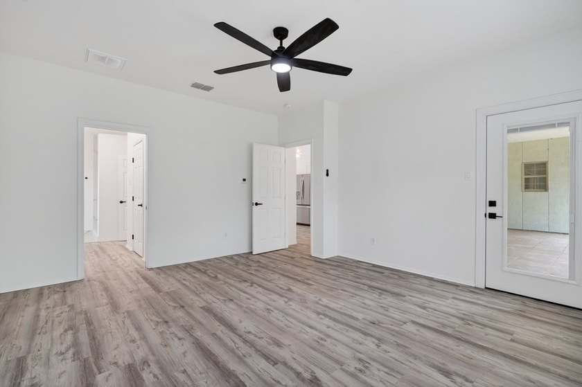 This lovely 2051 sq. ft. stucco home sits on a large lot in the - photo 19