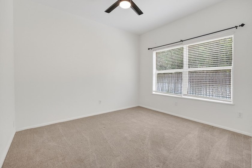 This lovely 2051 sq. ft. stucco home sits on a large lot in the - photo 23