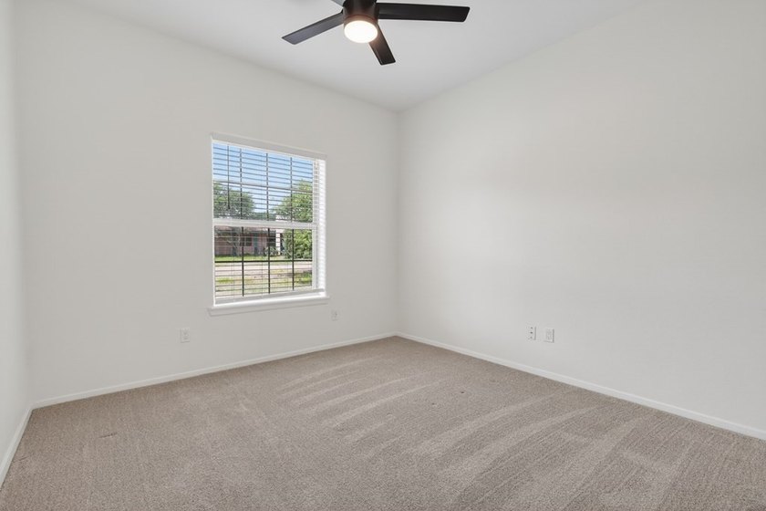 This lovely 2051 sq. ft. stucco home sits on a large lot in the - photo 24