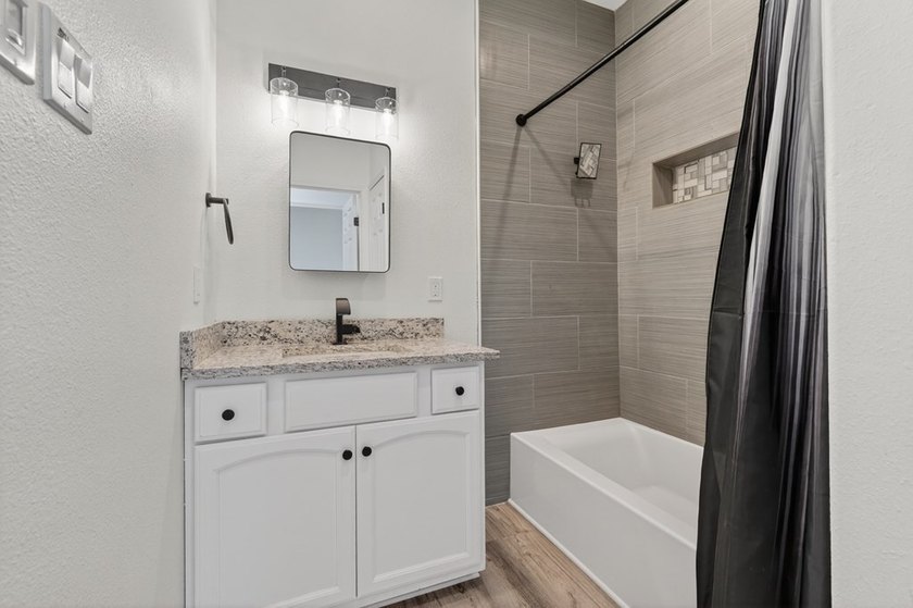 This lovely 2051 sq. ft. stucco home sits on a large lot in the - photo 25