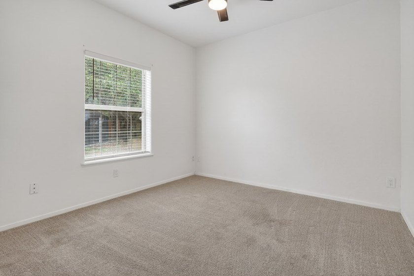 This lovely 2051 sq. ft. stucco home sits on a large lot in the - photo 26