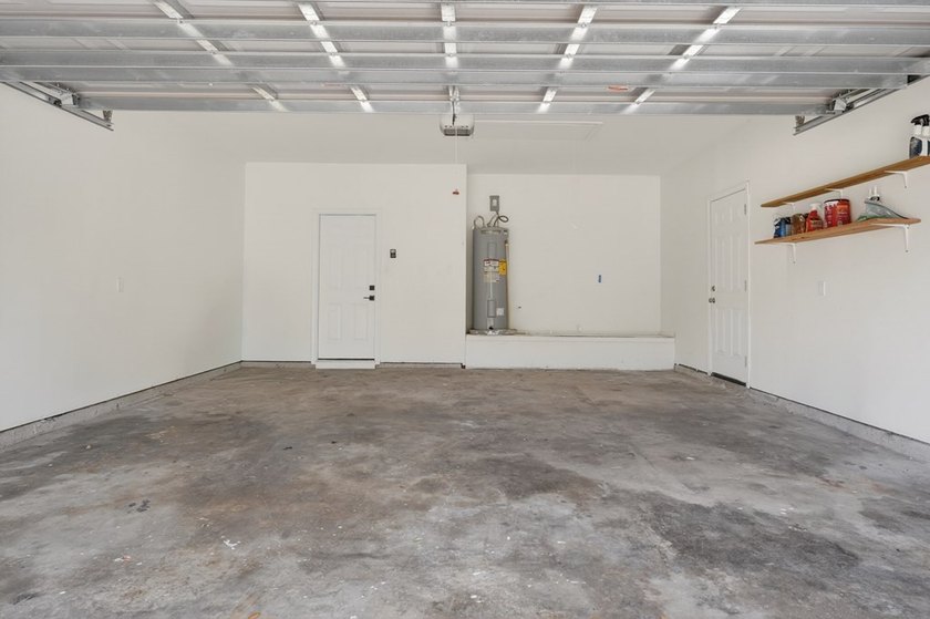 This lovely 2051 sq. ft. stucco home sits on a large lot in the - photo 27