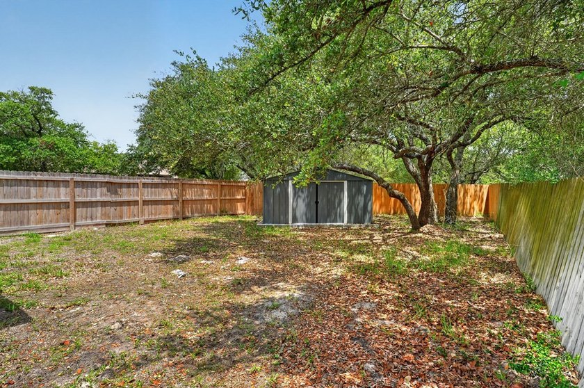 This lovely 2051 sq. ft. stucco home sits on a large lot in the - photo 32