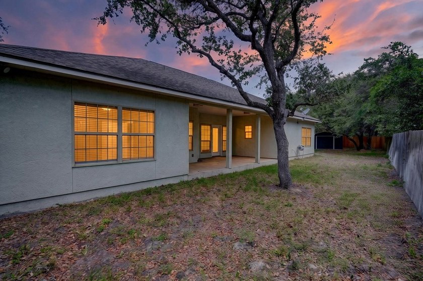This lovely 2051 sq. ft. stucco home sits on a large lot in the - photo 34