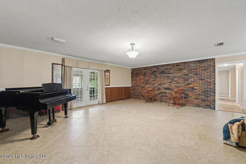 This large 1 level home has endless possibilities. 2 huge living - photo 3