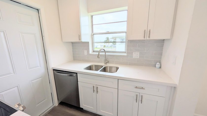 Don't miss this beautifully updated 2BR/1BA second-floor corner - photo 12