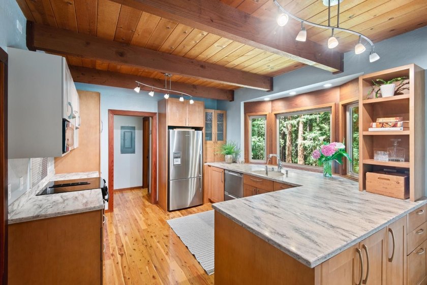 A private road and paved, circular driveway lead to this custom - photo 5