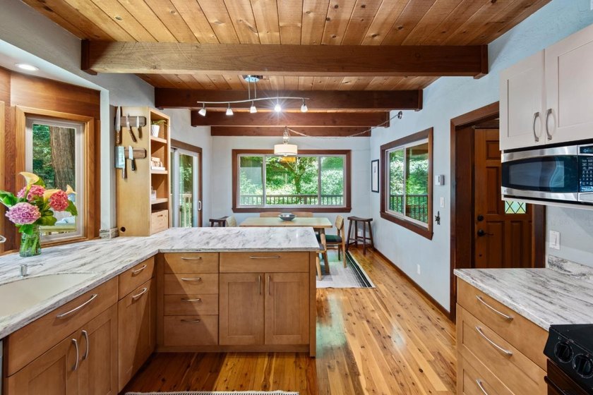 A private road and paved, circular driveway lead to this custom - photo 7