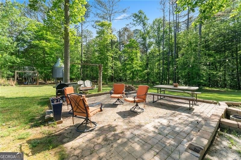 RARE OPPORTUNITY! Set on 4.4 private acres in one of Forsyth - photo 41