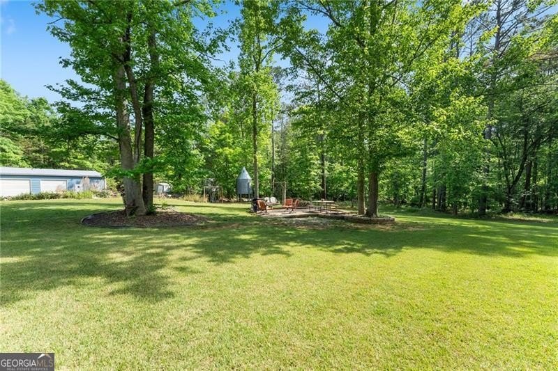 RARE OPPORTUNITY! Set on 4.4 private acres in one of Forsyth - photo 43
