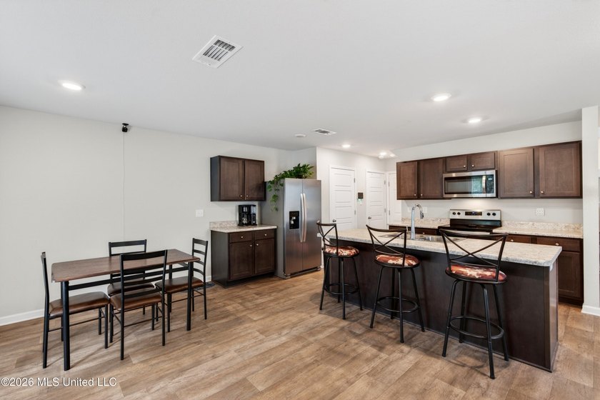Welcome to this spacious 3-bedroom, 2.5-bath home featuring a - photo 8