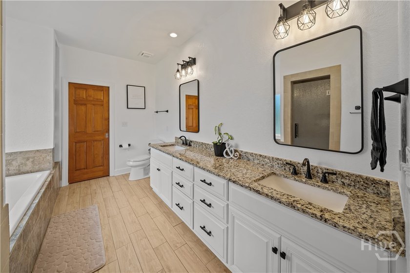 Welcome to this stunning full brick 4-bedroom, 3.5-bath home in - photo 32