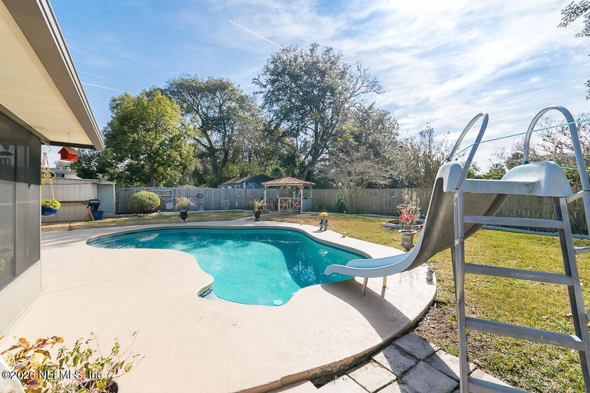 This spacious 3 bedroom, 2 bath POOL home offers 1,714 square - photo 7