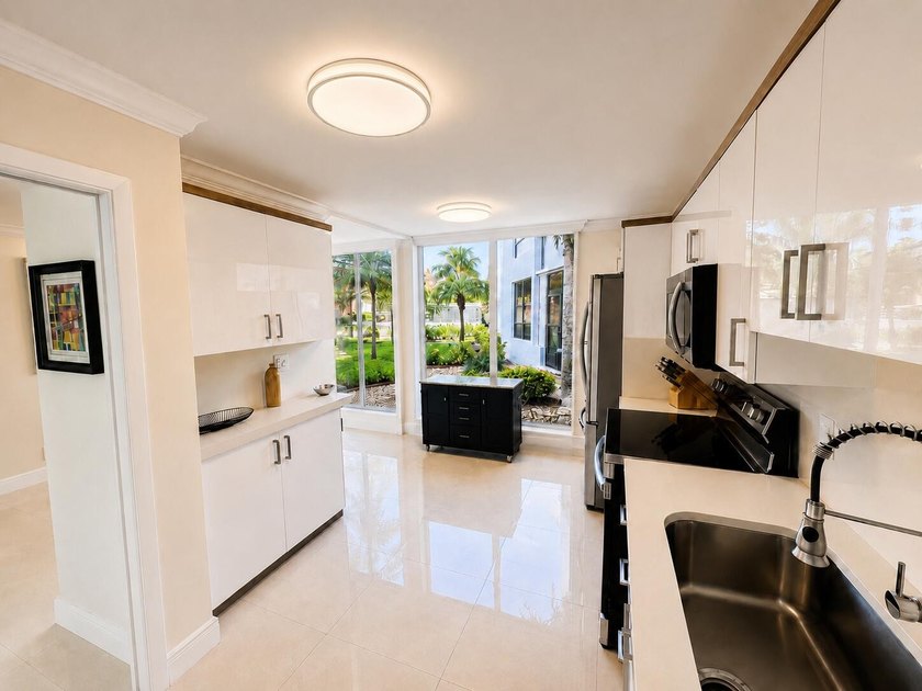 Welcome to Promenade at Boca Pointe. Beautifully renovated and - photo 3