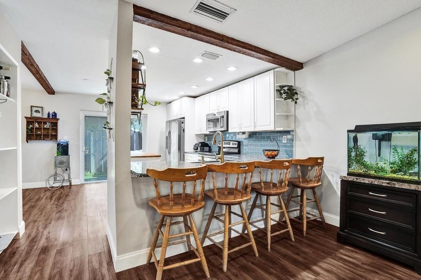 An updated and spacious corner villa in Forest Lake community at - photo 8
