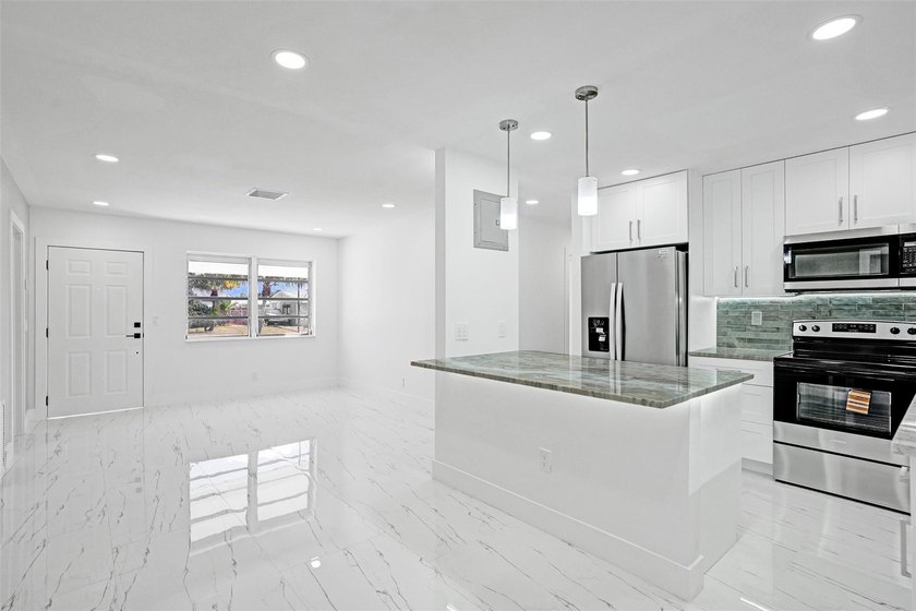 Completely renovated 4-bedroom, 3-bathroom home in desirable - photo 8