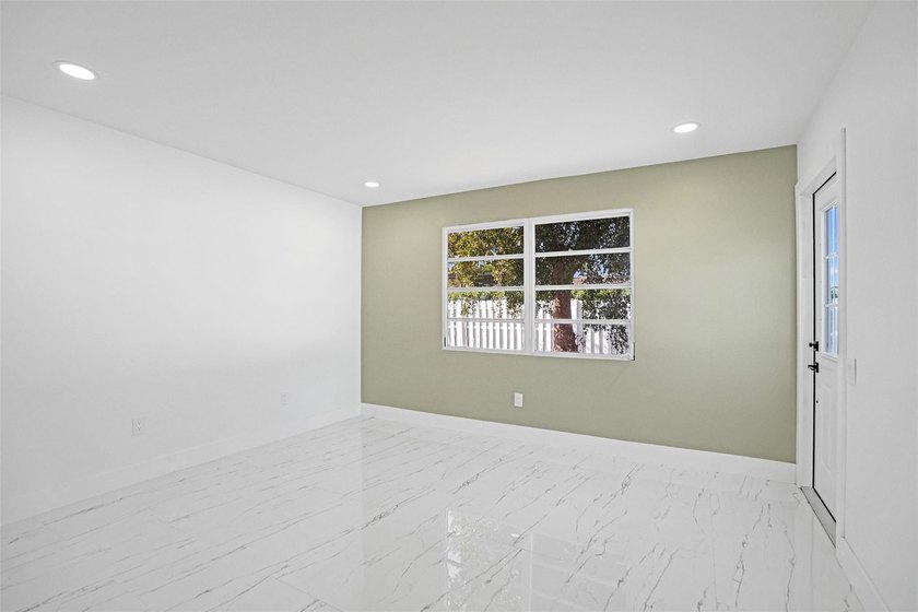 Completely renovated 4-bedroom, 3-bathroom home in desirable - photo 9