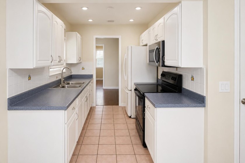 This well-maintained 3-bedroom, 2-bath home offers a bright - photo 8