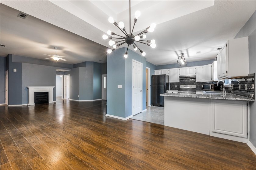Tucked beneath a mature hardwood canopy in an established - photo 3