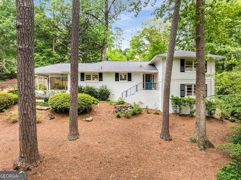 Nestled on a large 3/4+ acre serene, corner lot in the highly - photo 2
