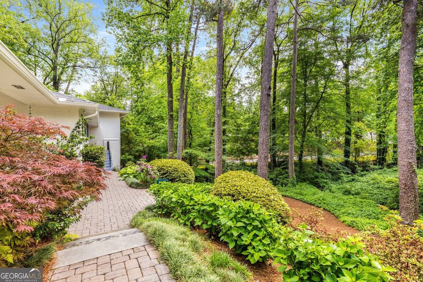 Nestled on a large 3/4+ acre serene, corner lot in the highly - photo 5