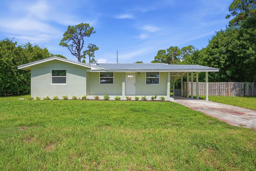 This charming single family home is tucked away in the back - photo 3