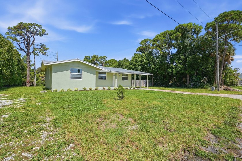 This charming single family home is tucked away in the back - photo 4