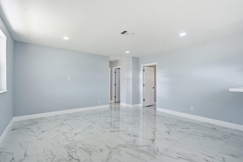 This charming single family home is tucked away in the back - photo 7