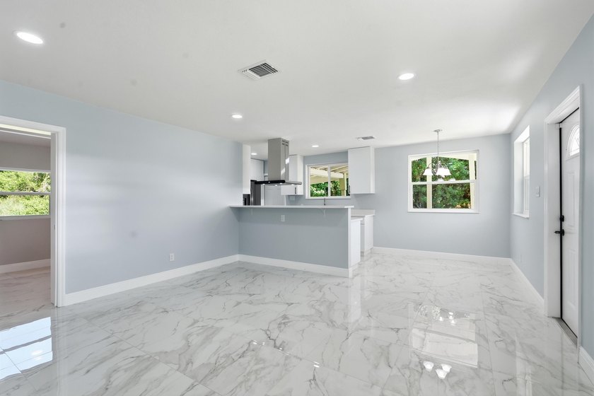This charming single family home is tucked away in the back - photo 8