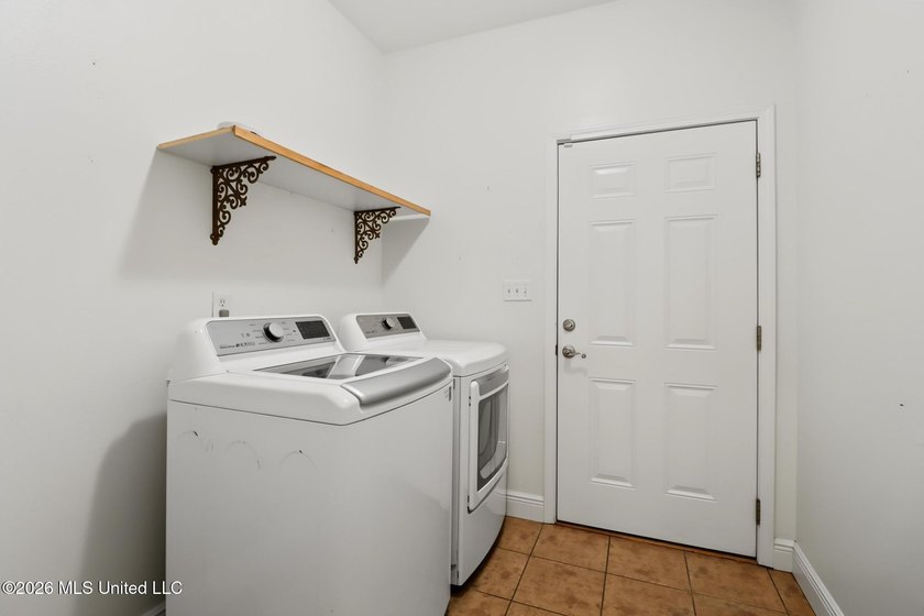 Move-in ready and just minutes from the beach! This beautiful - photo 12