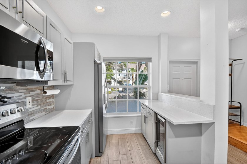 Updated and impeccable end unit townhouse in the highly sought - photo 9