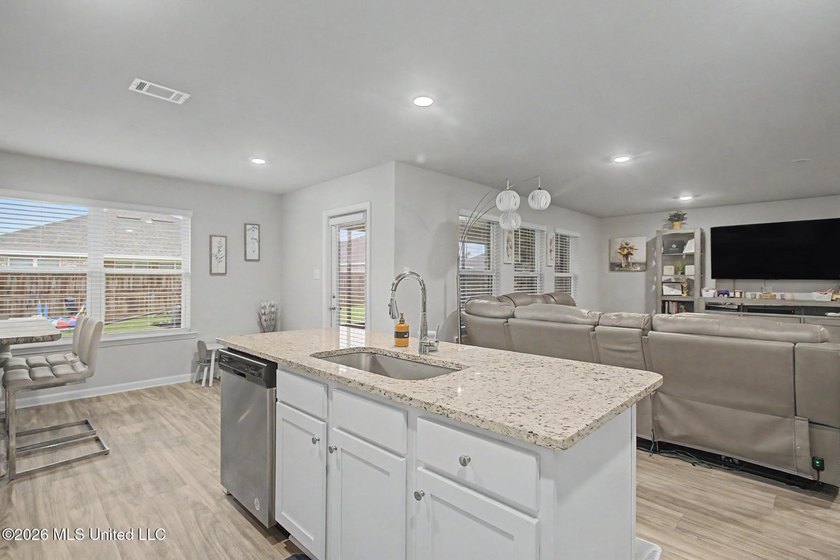 Welcome home to this spacious 4-bedroom, 2-bath property - photo 3