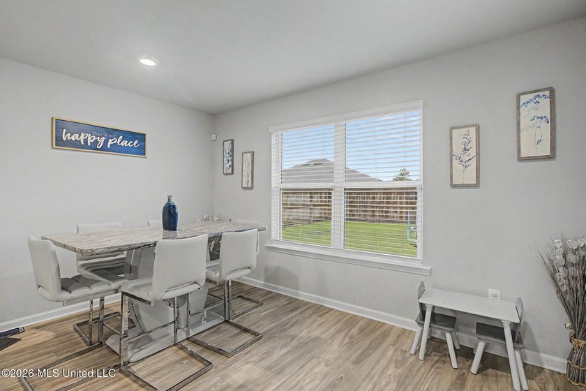 Welcome home to this spacious 4-bedroom, 2-bath property - photo 4
