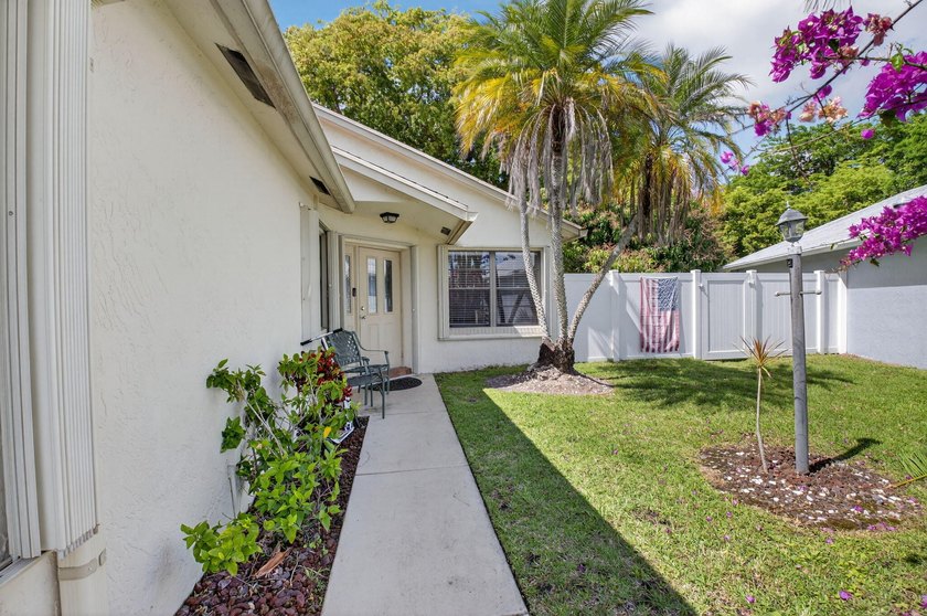 This beautifully renovated 3-bedroom, 2-bath home is tucked away - photo 3