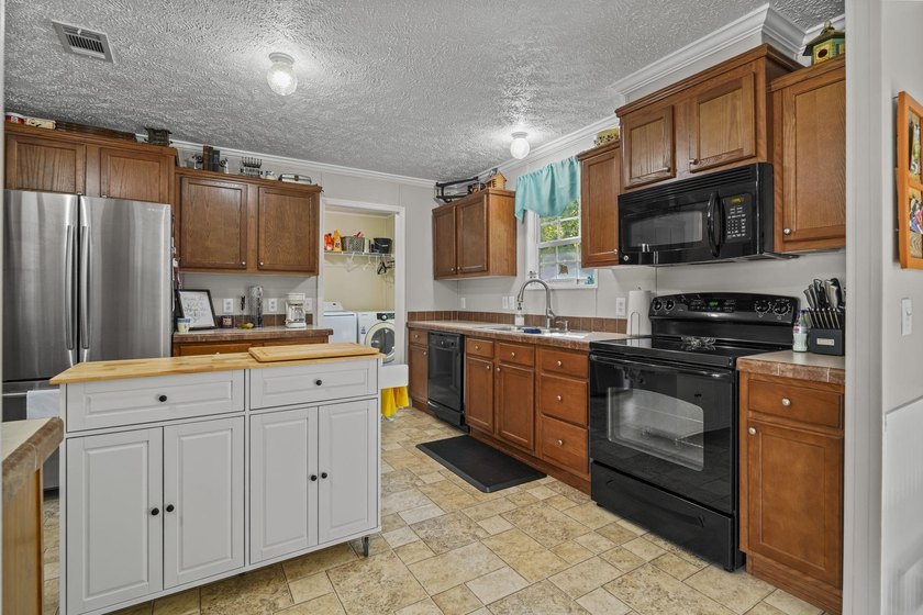 Three-bedroom, two-bathroom, single-story manufactured home with - photo 11