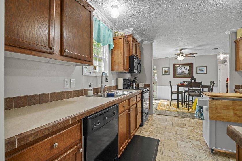 Three-bedroom, two-bathroom, single-story manufactured home with - photo 14