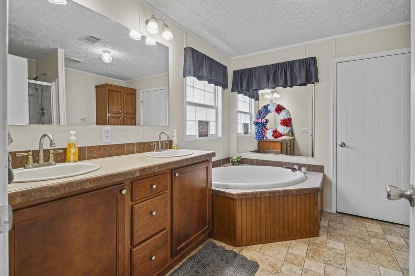 Three-bedroom, two-bathroom, single-story manufactured home with - photo 23