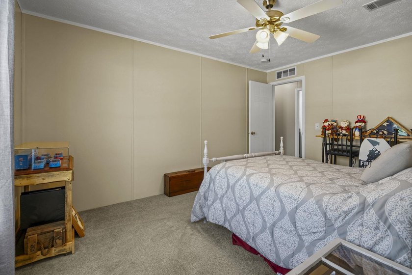 Three-bedroom, two-bathroom, single-story manufactured home with - photo 27