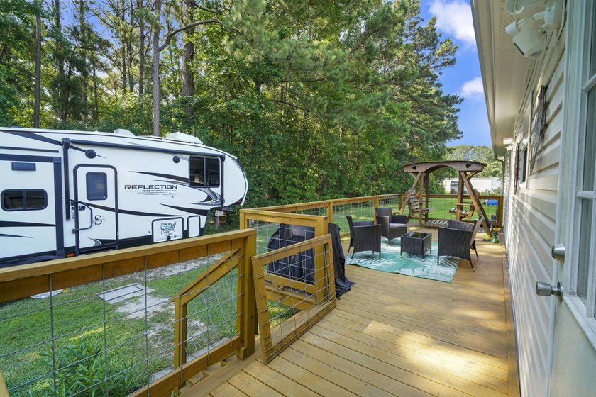 Three-bedroom, two-bathroom, single-story manufactured home with - photo 35