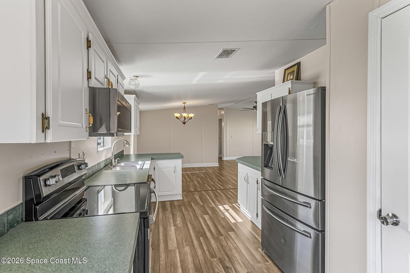Enjoy this charming 3-bed, 2-bath home in Palm Bay Estates, a - photo 11