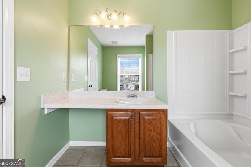 Built in 2005, this 1,551 sq. ft. 2-story townhome features 3 - photo 18