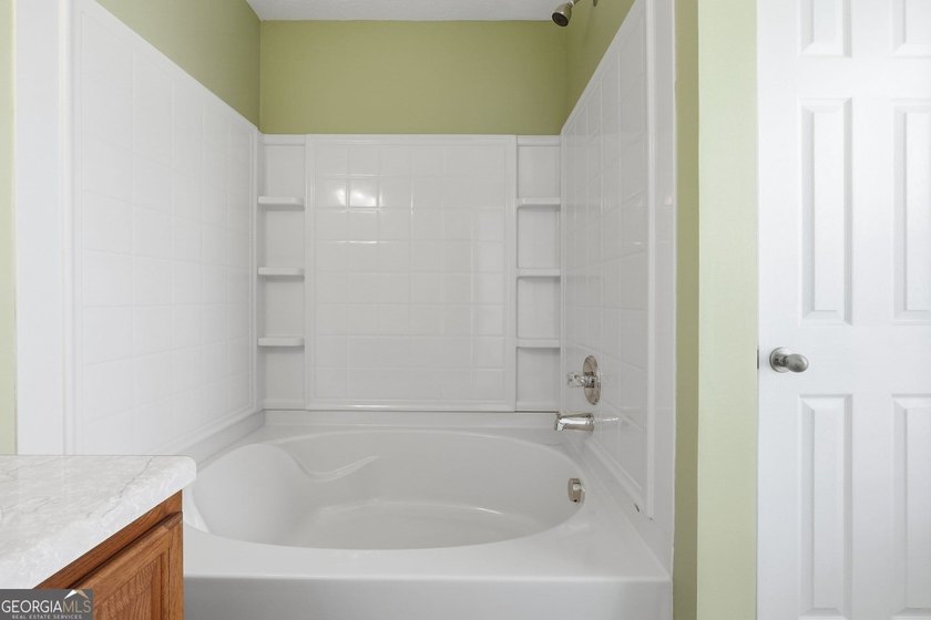 Built in 2005, this 1,551 sq. ft. 2-story townhome features 3 - photo 19