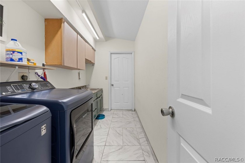 Welcome to this former model home tucked away on a private - photo 7